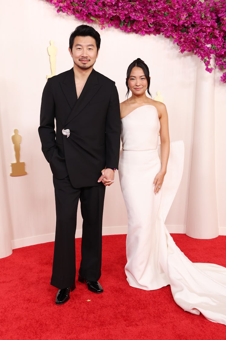 Simu Liu and Allison Hsu attend the 96th Annual Academy Awards on March 10, 2024 in Hollywood, Calif...