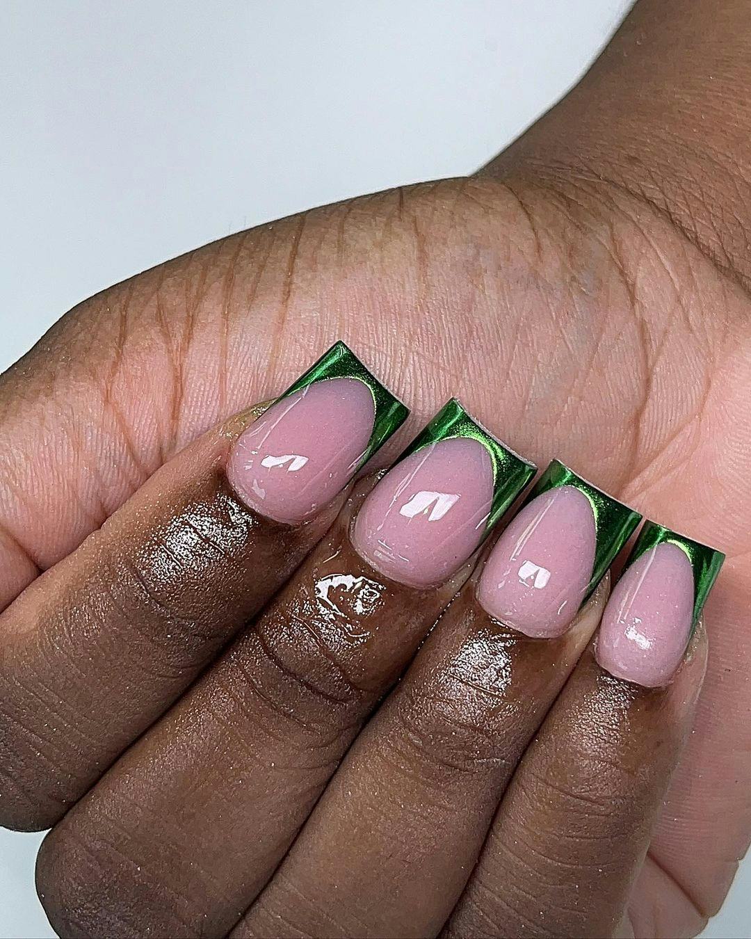 Green chrome French tip nails are trending for spring 2024.