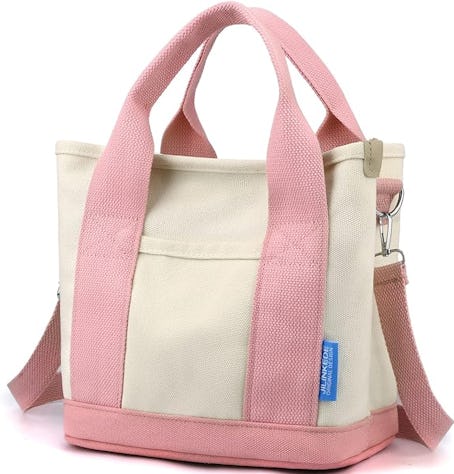 This mini canvas tote bag is pink. 