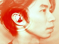 Side profile of a person with an earbud, with a reddish-orange tinted overlay.