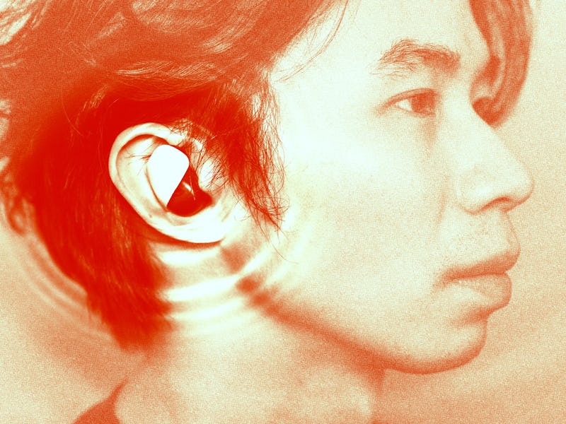 Side profile of a person with an earbud, with a reddish-orange tinted overlay.