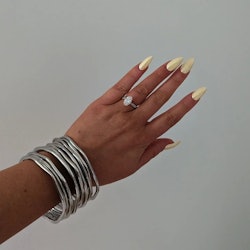 How to rock yellow chrome nails, spring's most cheerful manicure trend.