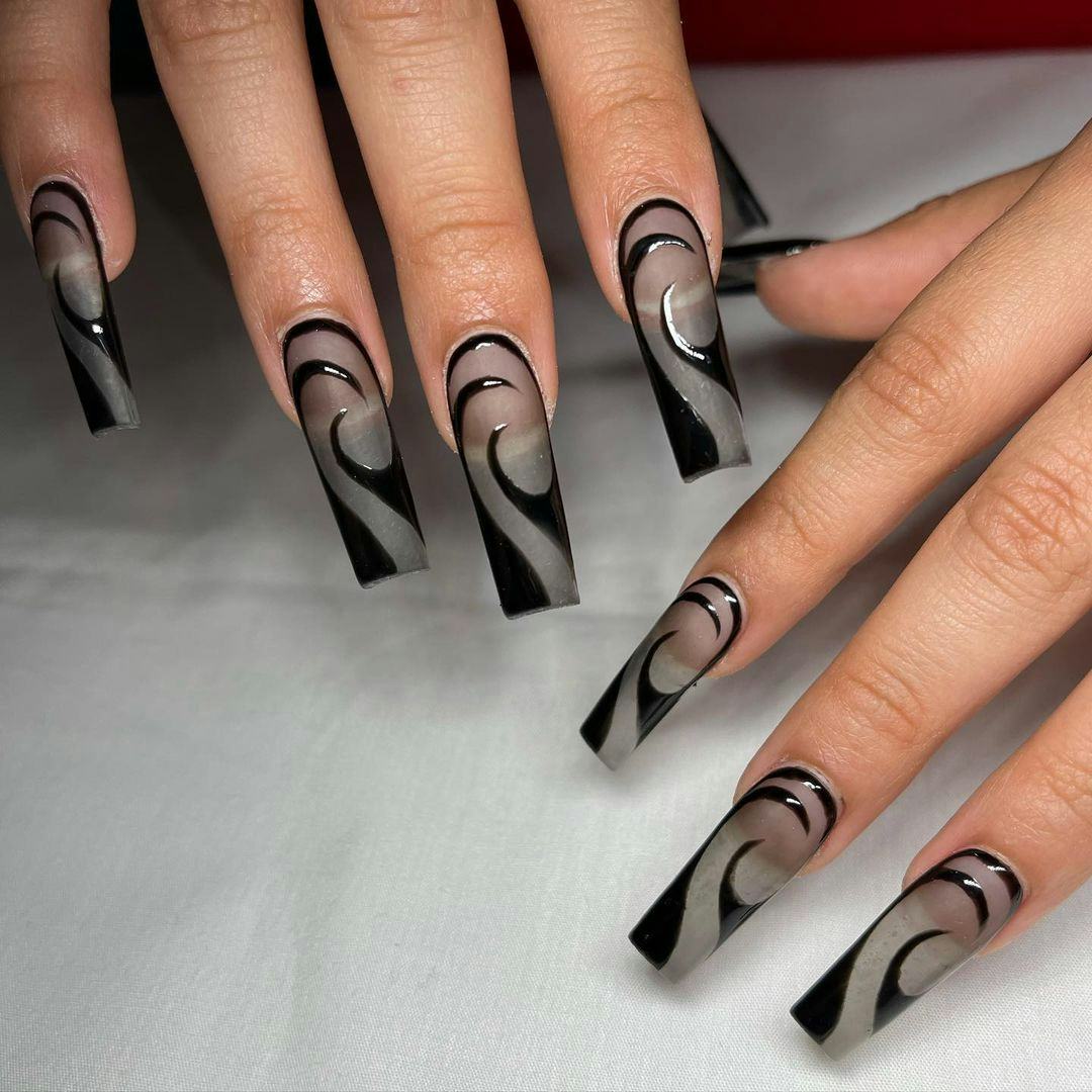 Sheer black nail art matches the &ldquo;grunge girl&rdquo; aesthetic.