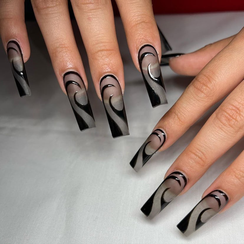 Sheer black nail art matches the "grunge girl" aesthetic.