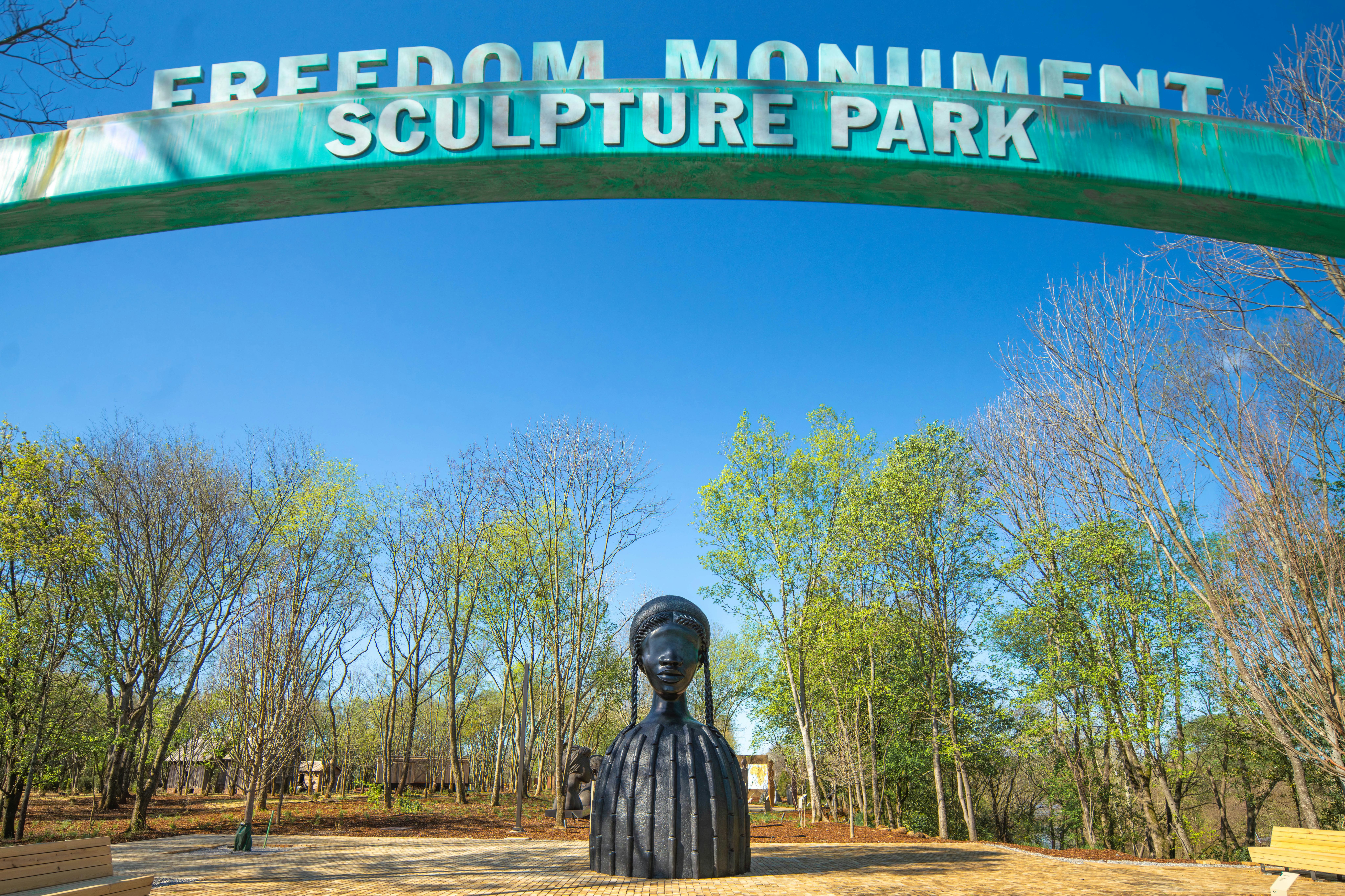 a look at the freedom monument sculpture park and simone leigh's brick house statue