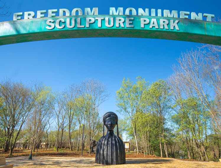 a look at the freedom monument sculpture park and simone leigh's brick house statue