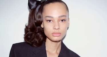 Model with ponytail and hair bow