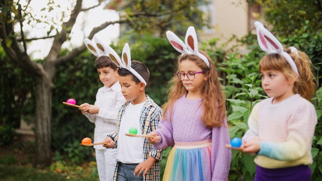 Kids line up on Easter to do an Easter egg race.