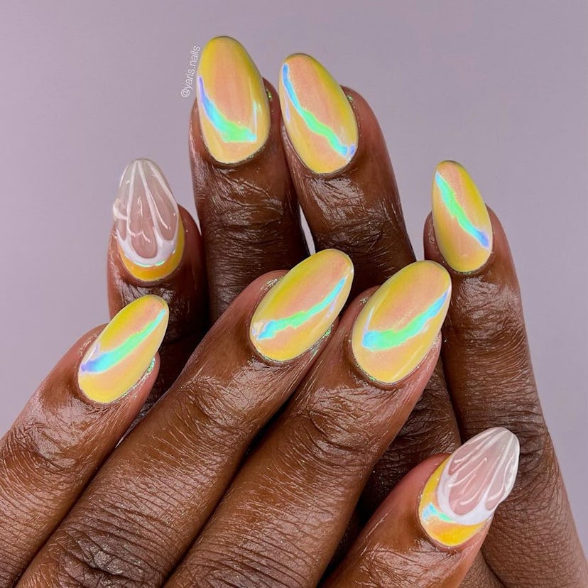 Yellow chrome nails with lemon art are on-trend for spring 2024.