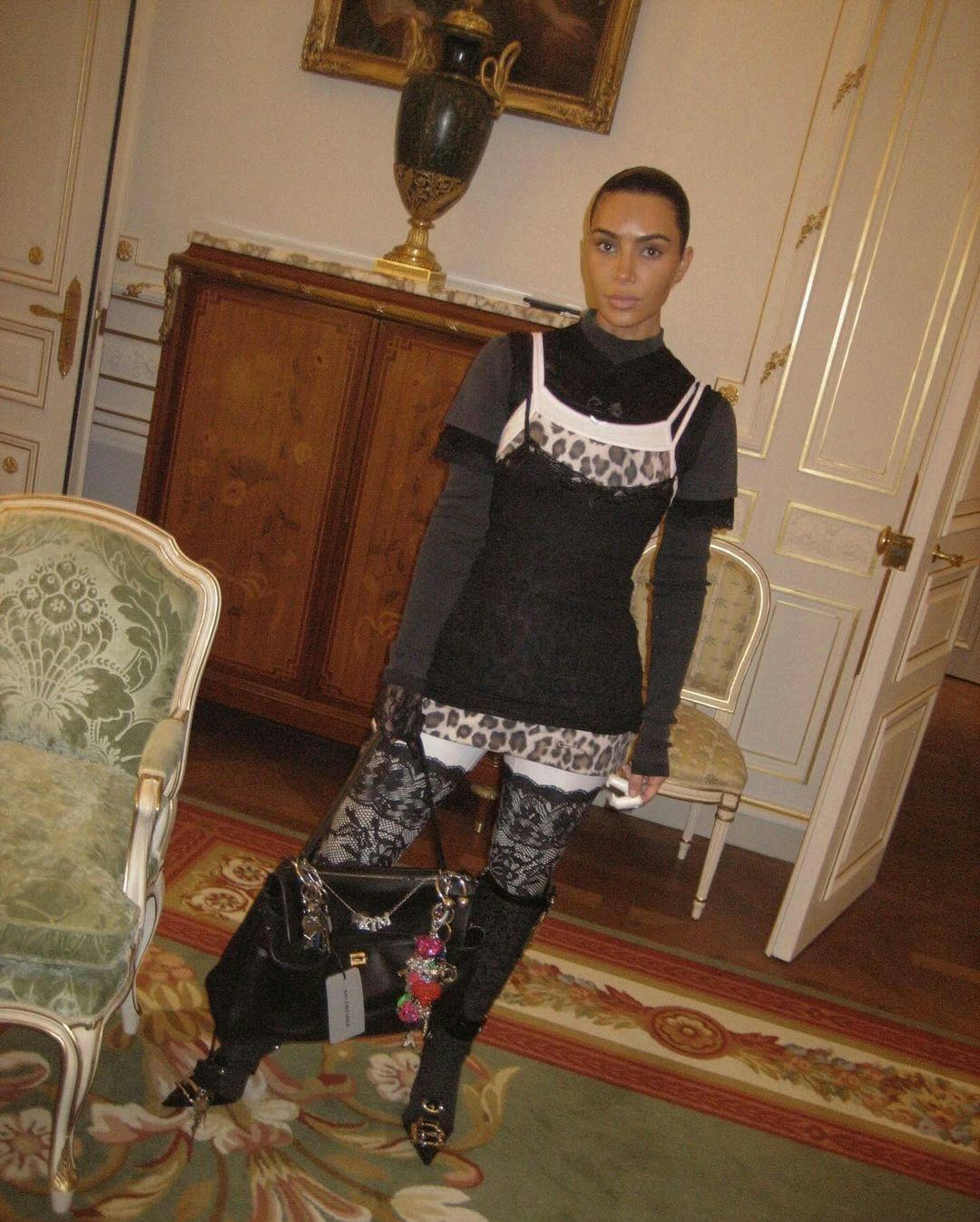 Kim Kardashian wears the chaotic multi-layered tank style from the early 2000s.