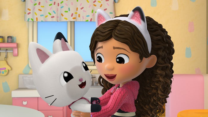 Gabby and Pandypaws hug in the latest season of 'Gabby's Dollhouse.'