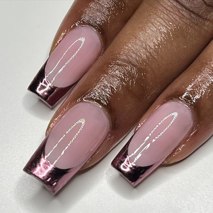 Cool-toned pink chrome French tip nails are trending for Aries season 2024.