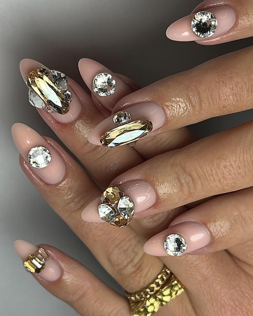 Oversized diamond nail adornments are trending for Aries season 2024.