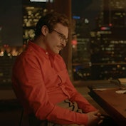 A man sitting in front of his computer at night, from the movie "Her."