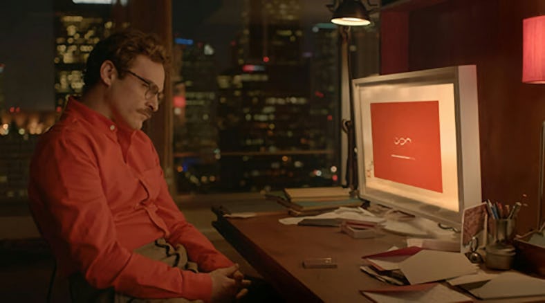 A man sitting in front of his computer at night, from the movie "Her."