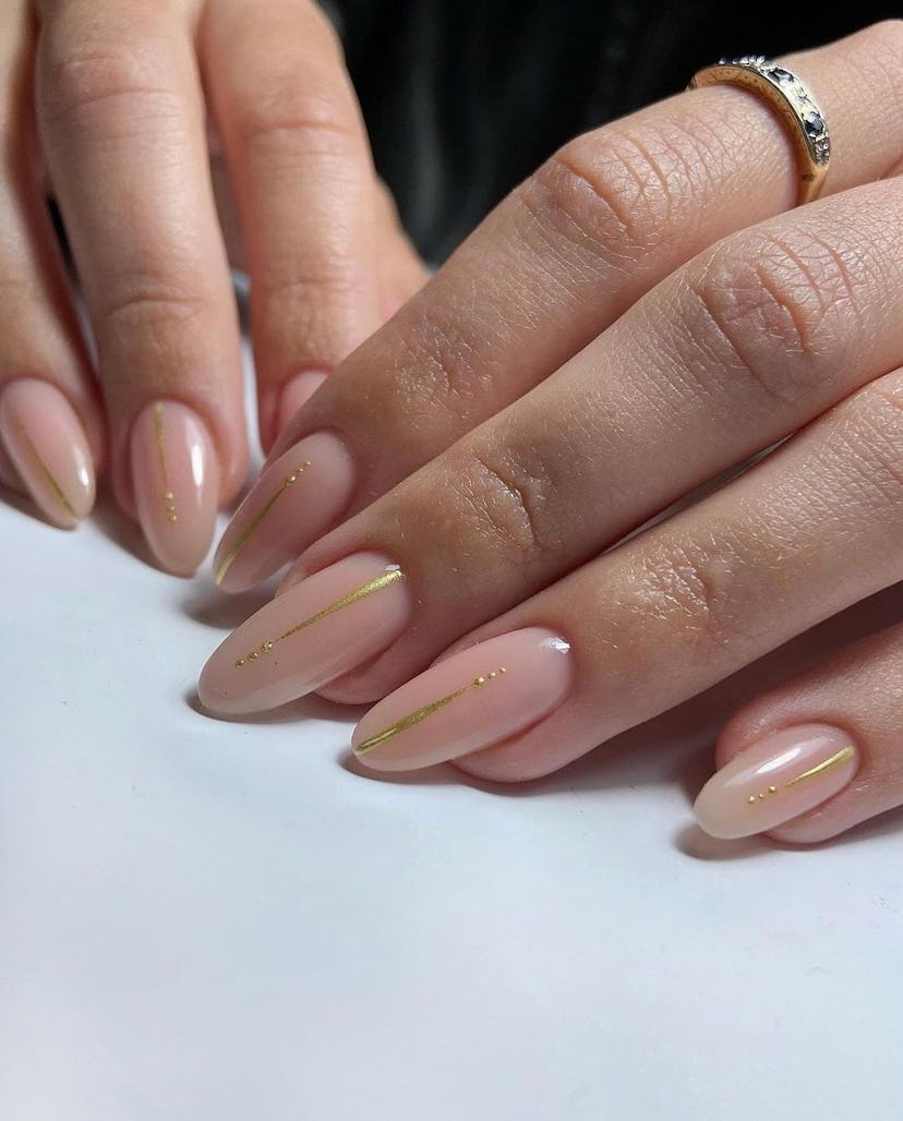 Minimal gold chrome fine lines are on-trend for summer 2024.