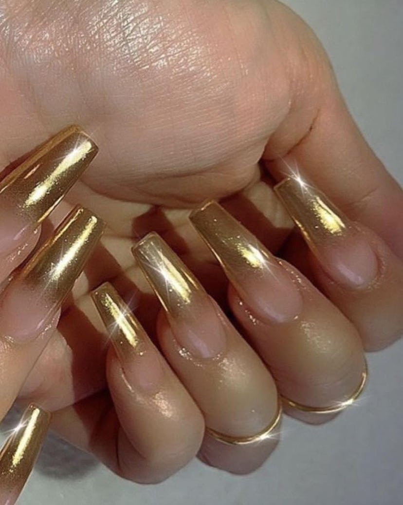 Gold chrome ombré nails are on-trend for summer 2024.