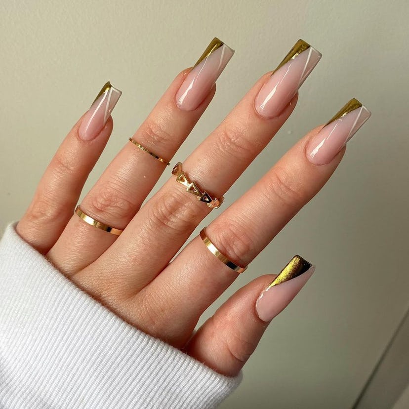Gold chrome angled tips are on-trend for summer 2024.