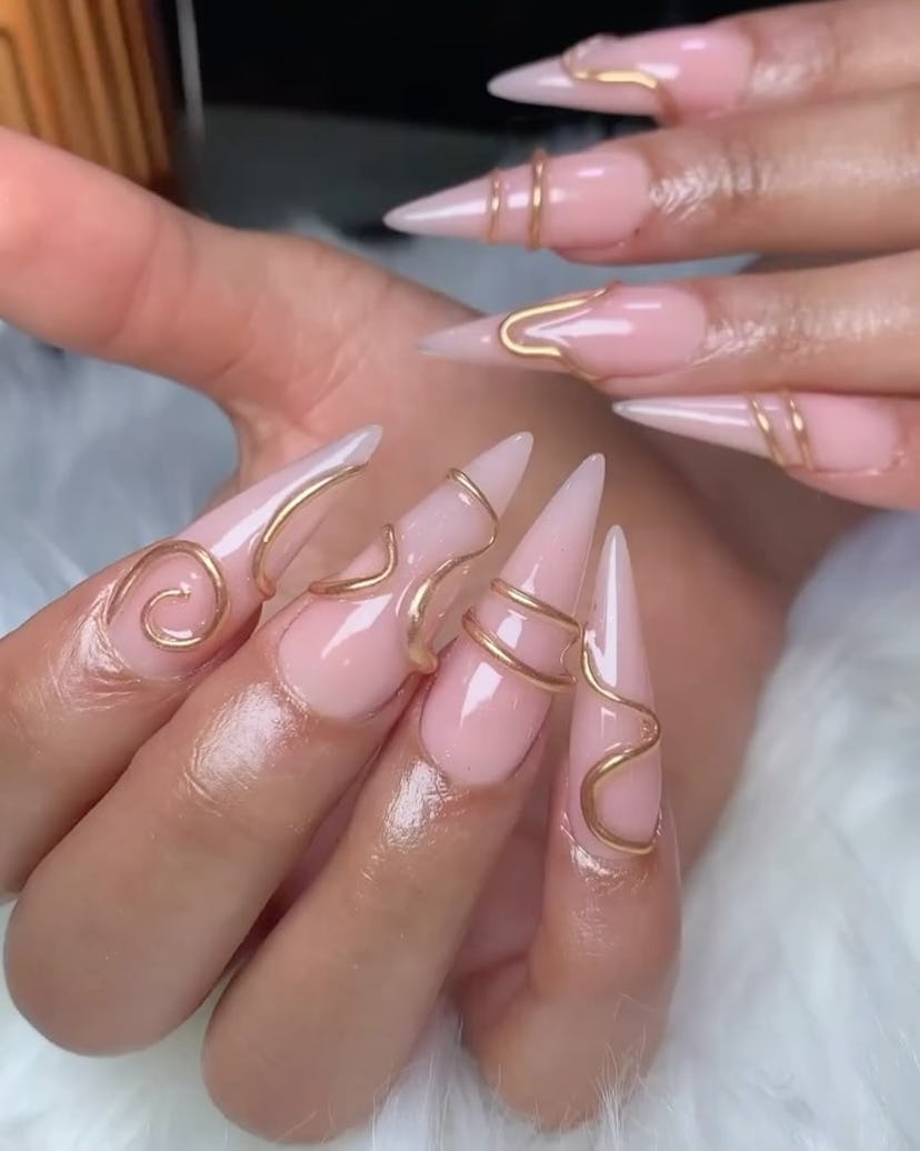 3D gold nail rings are on-trend for summer 2024.