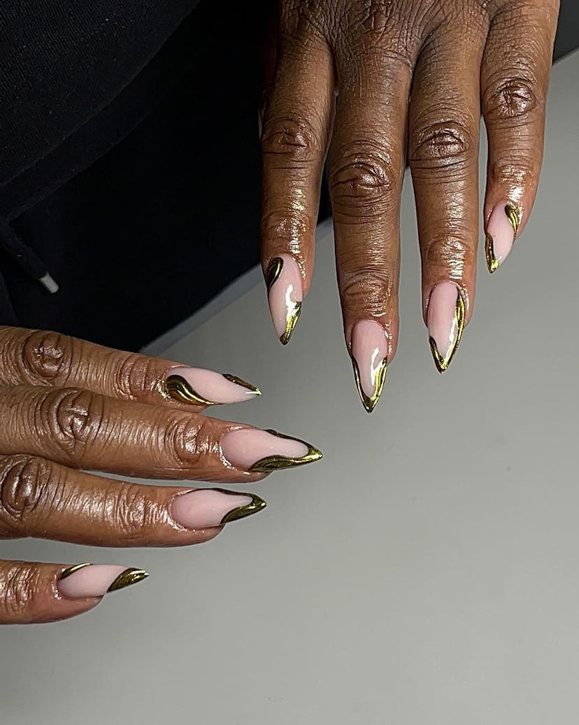 Abstract gold chrome wave designs are on-trend for summer 2024.
