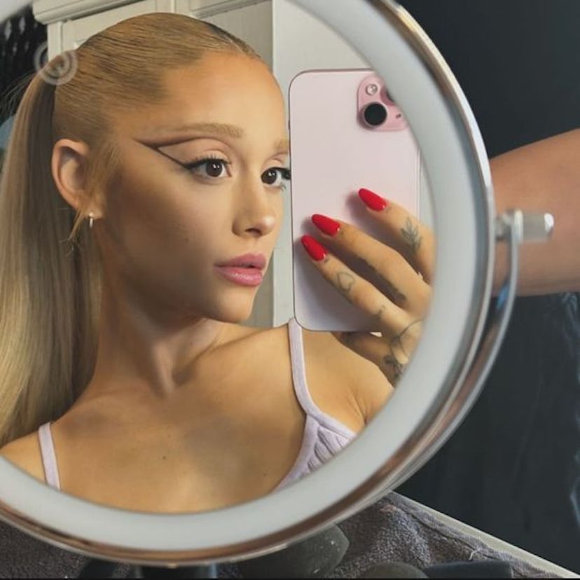 Ariana Grande is loving the r.e.m. beauty Essential Drip Glossy Balm in shade Strawberry Soda, which...