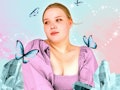 Young woman surrounded by butterflies after reading her April horoscope.