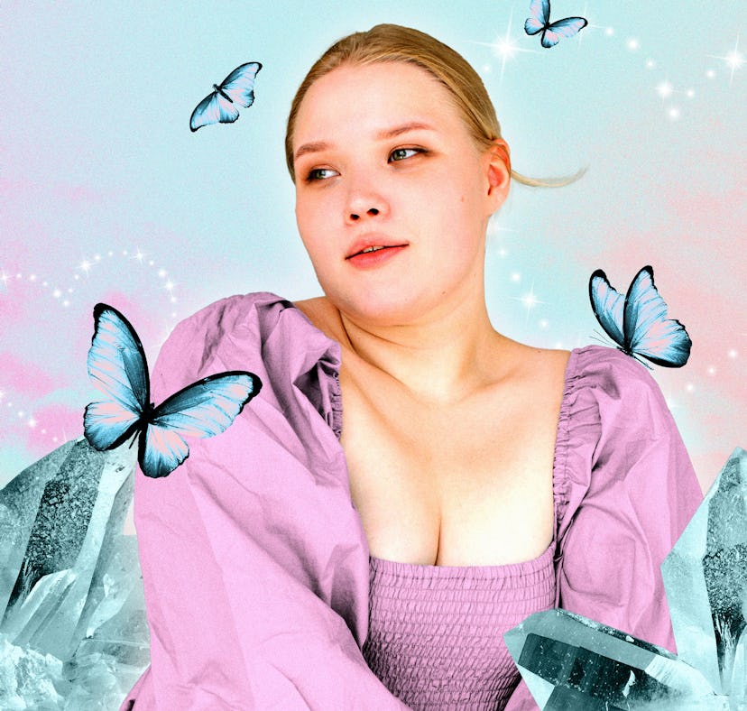 Young woman surrounded by butterflies after reading her April horoscope.