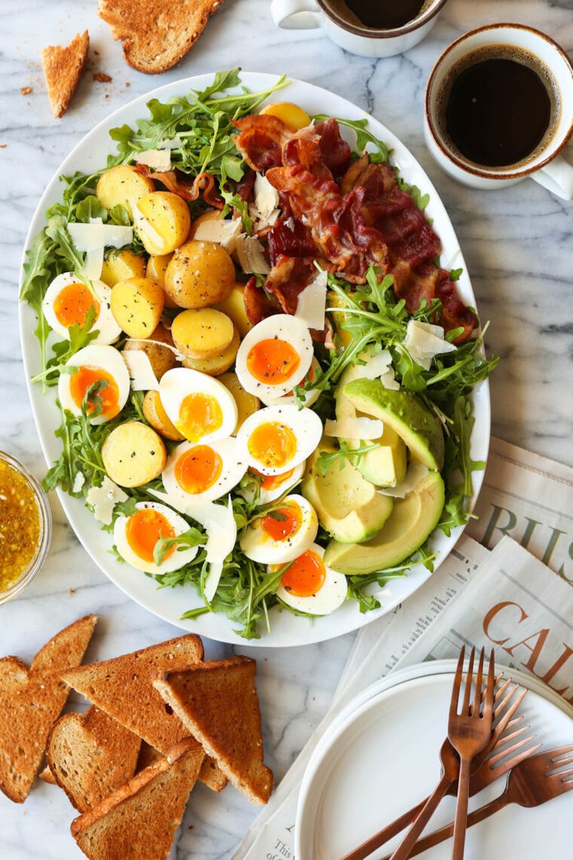 A breakfast salad with lettuce, bacon, and eggs, in a story about boiled egg recipes to use up Easte...