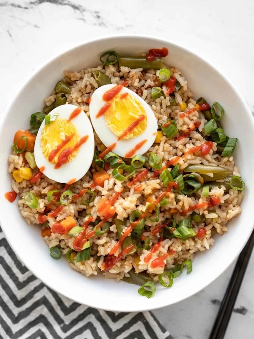 Veggie and boiled egg rice bowl, in a story about boiled egg recipes to use up Easter eggs.