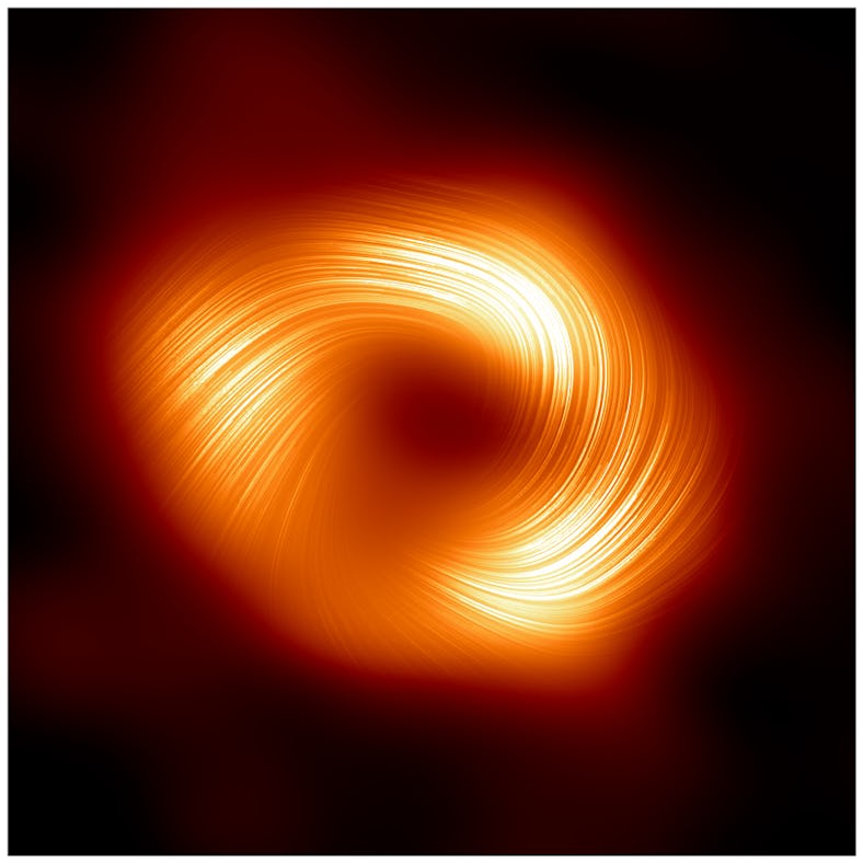 Circular swirl pattern with bright orange and yellow tones on a dark background, resembling a galaxy...