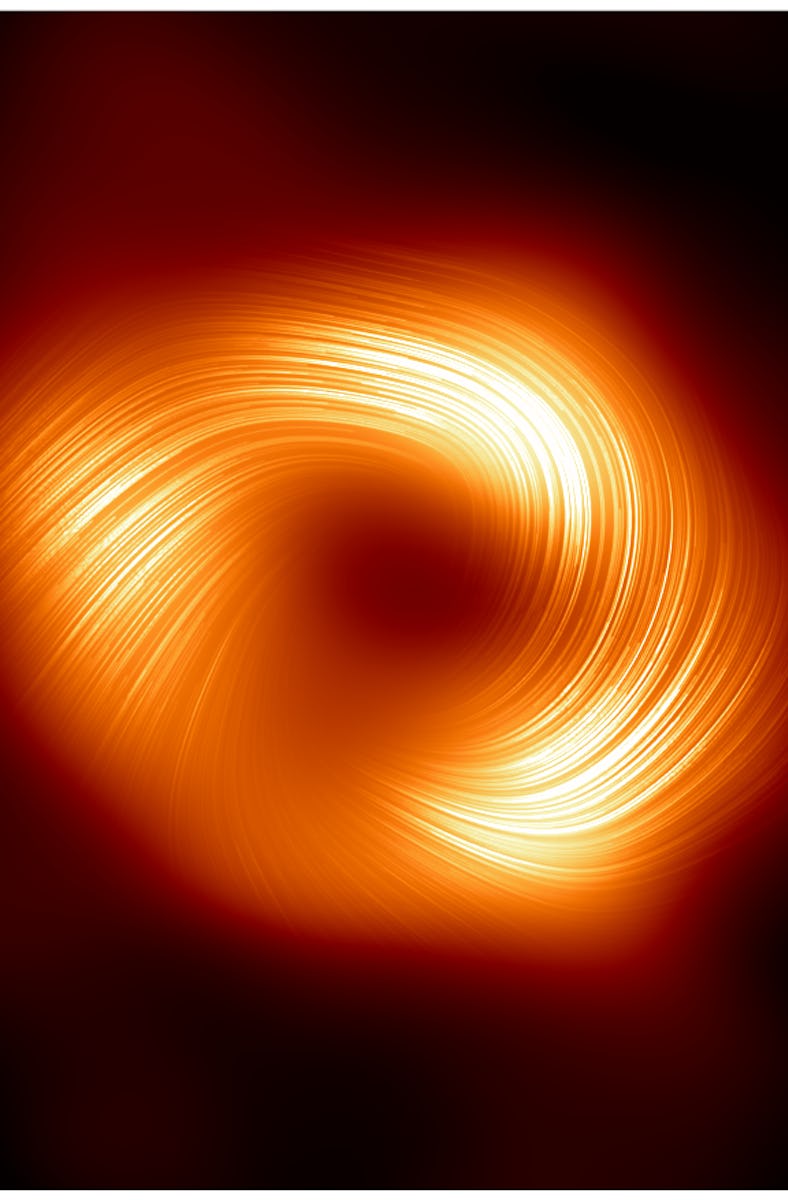 Circular swirl pattern with bright orange and yellow tones on a dark background, resembling a galaxy...