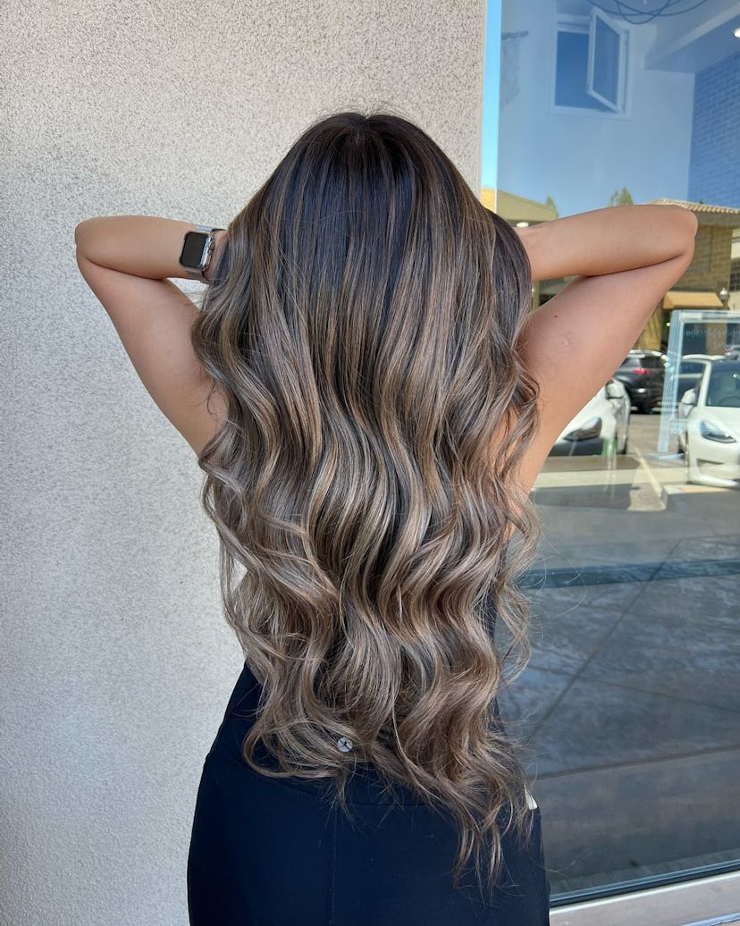 Cool-toned brown hair colors are trending for summer 2024.