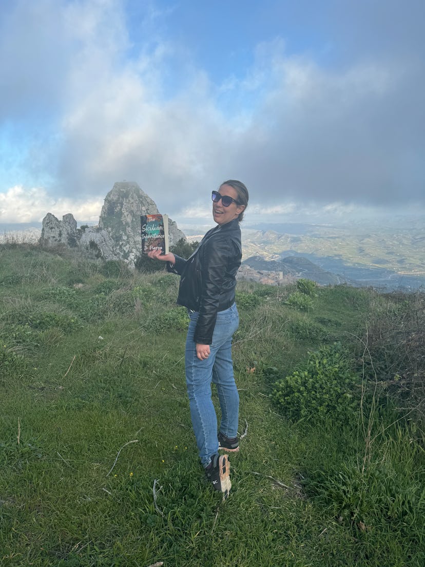Jo Piazza with her novel, The Sicilian Inheritance, in Sicily.