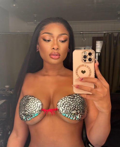 Megan Thee Stallion's black bob haircut and rhinestone tattoos are such a serve.