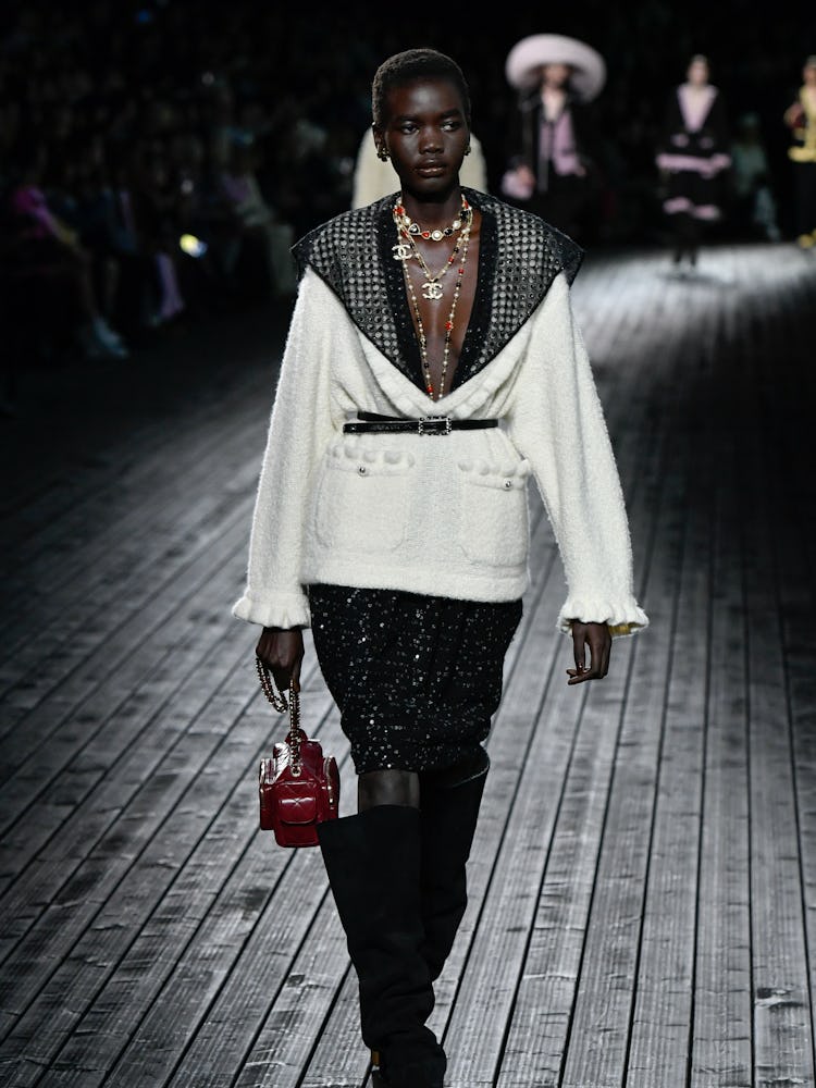 A model on the runway at Chanel RTW Fall 2024 as part of Paris Ready to Wear Fashion Week held at Gr...
