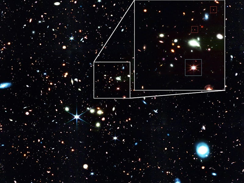 Deep space image showing numerous stars and galaxies with a highlighted section focusing on a specif...