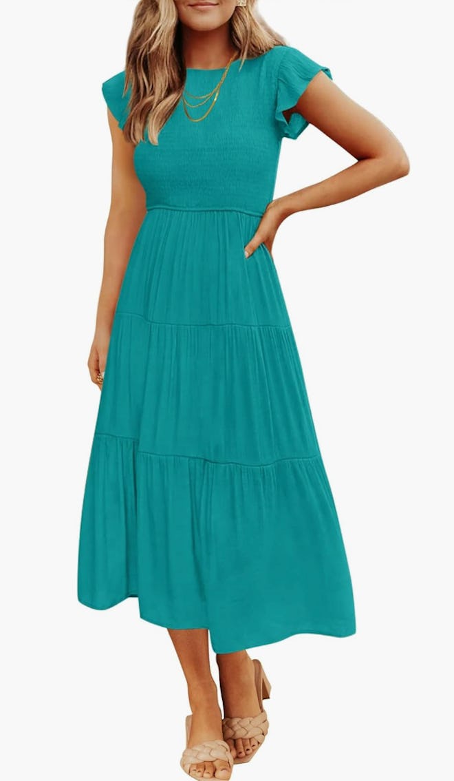 A women's casual smocked midi Easter dress in peacock green.
