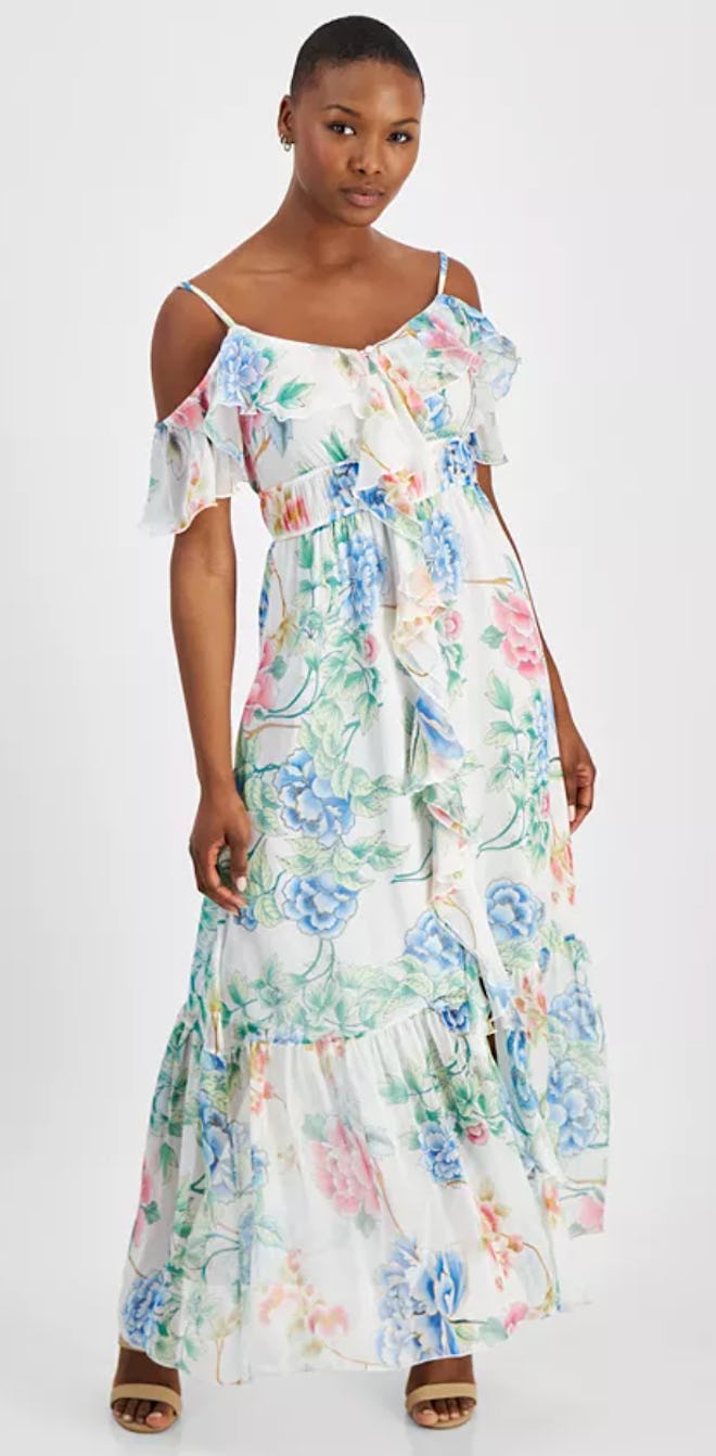 A white and pastel floral Easter dress with ruffles and a cold-shoulder design.