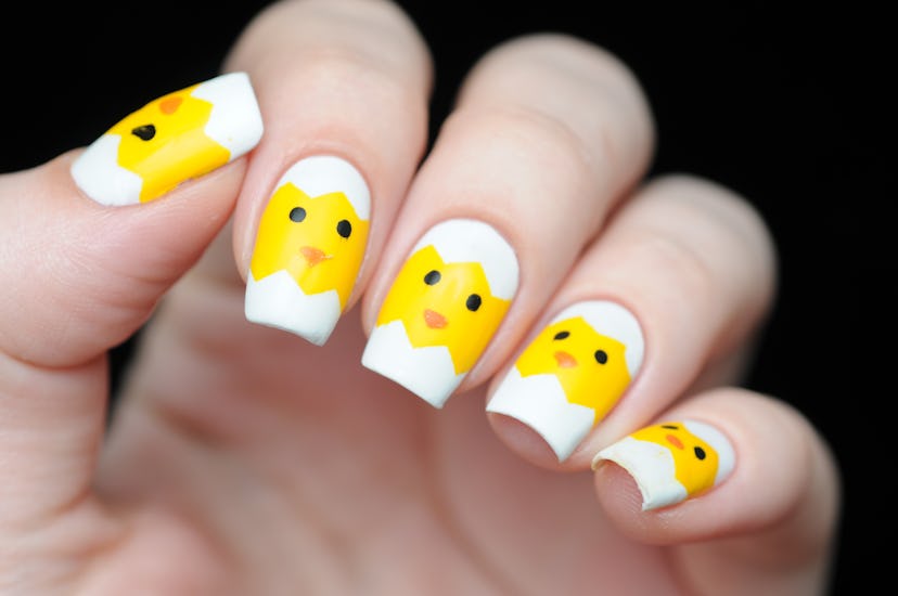 Nail art of chicks hatching from their eggs, which would be so cute as your Easter 2024 nail designs...
