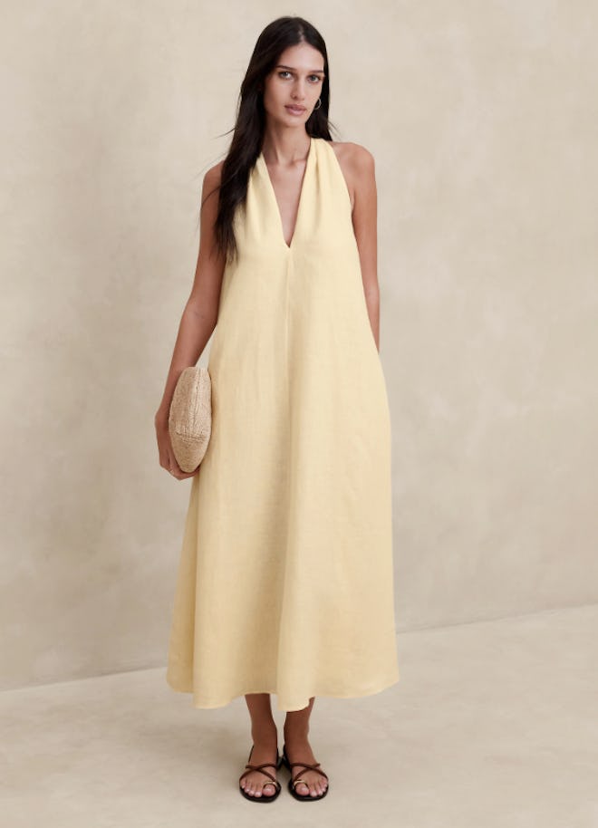 A long and airy vanilla-colored linen Easter dress for women.