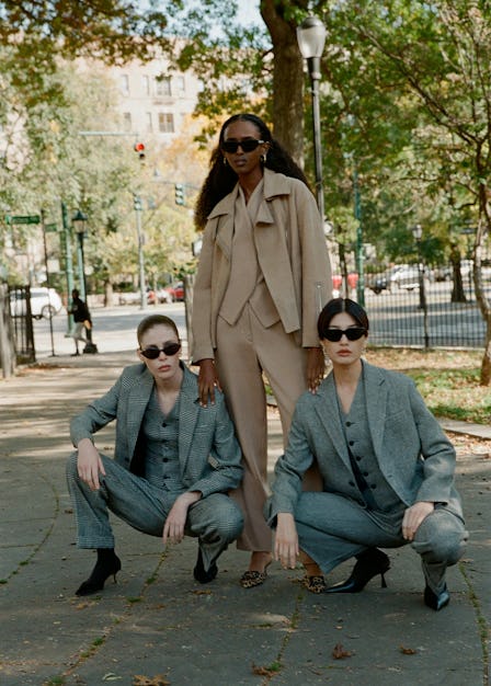 Three models pose in a Brooklyn park