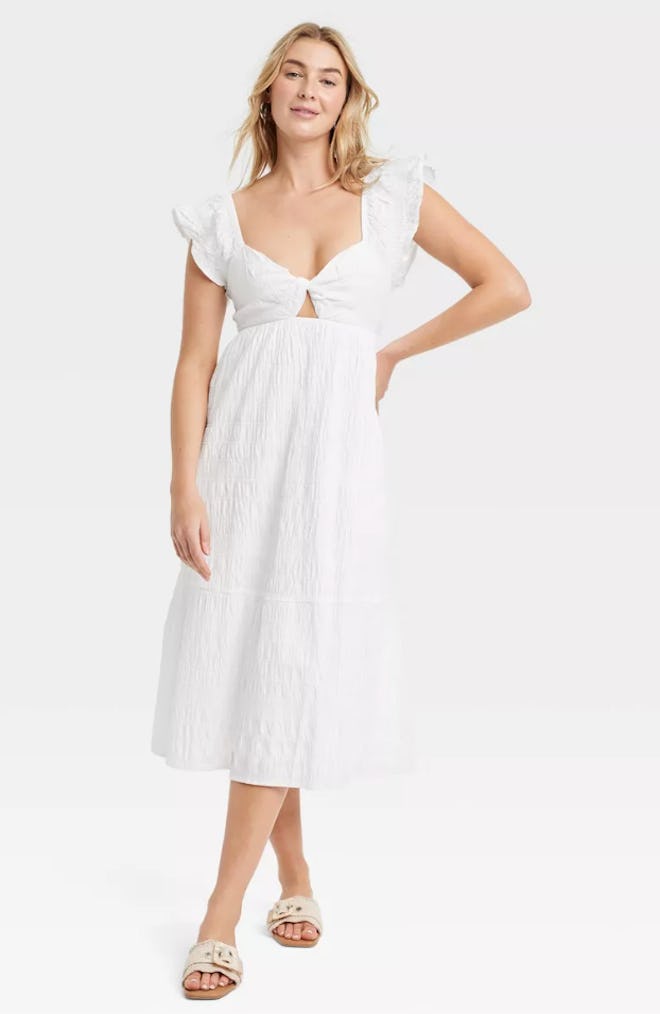 A short white Easter dress for women from Target with a keyhole detail and flutter sleeves.