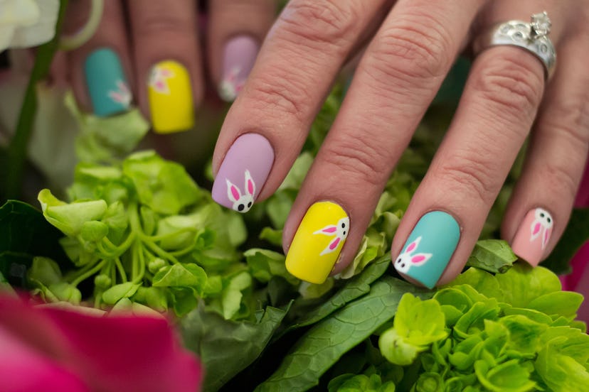 Peeking bunnies nail art, which would be so cute as your Easter 2024 nail designs.