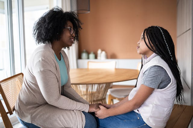 A woman talks to her tween daughter.