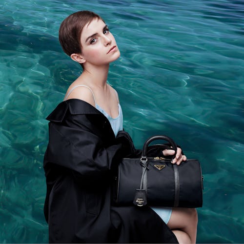 Emma Watson holding the Prada Re-Edition 1978 black bag