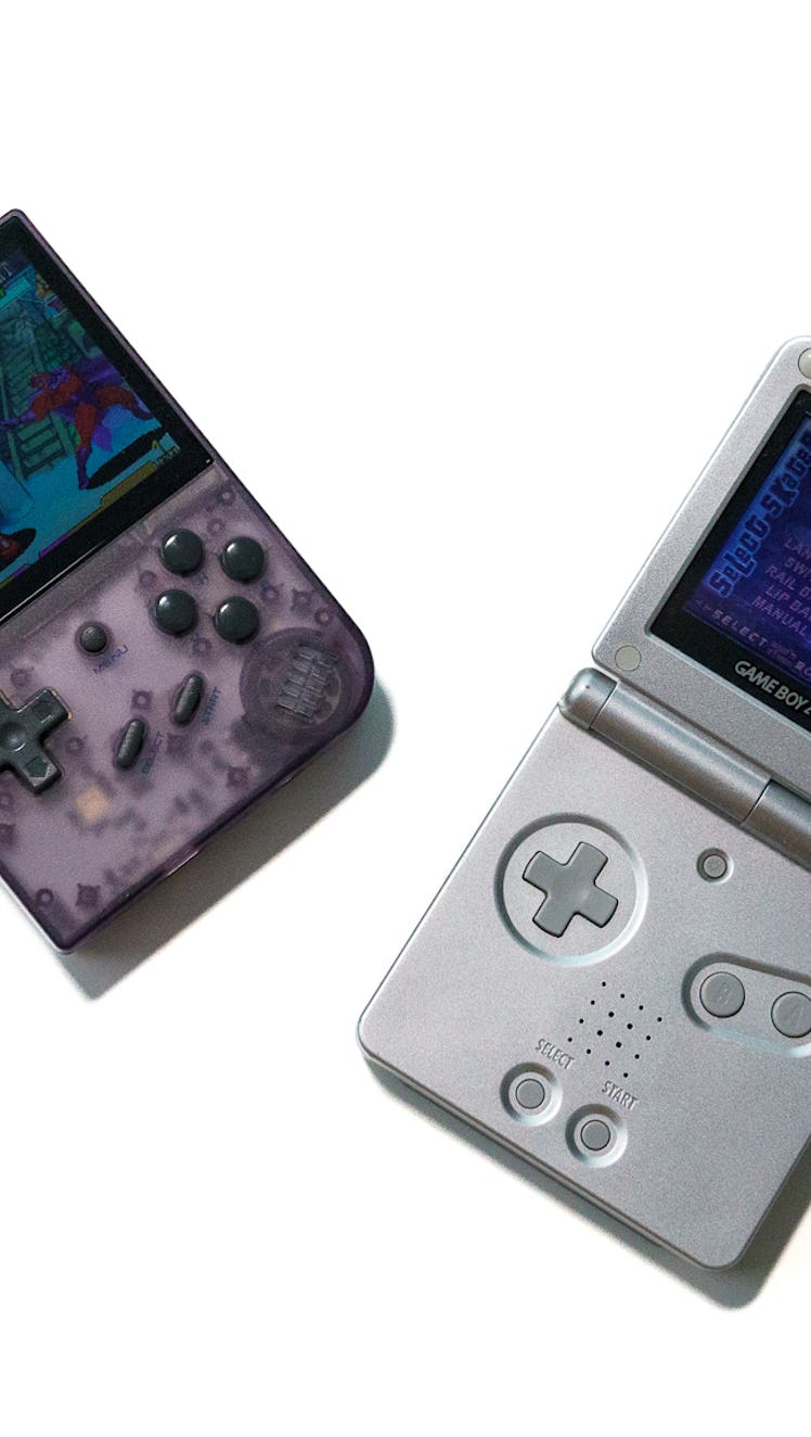 An Anbernic RG35XX retro handheld capable of playing Nintendo and PlayStation ROMS next to a Game Bo...