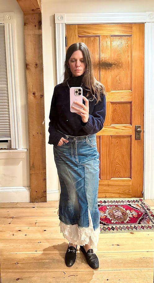 Julia Gall wearing navy turtlneck and denim with white lace maxi skirt