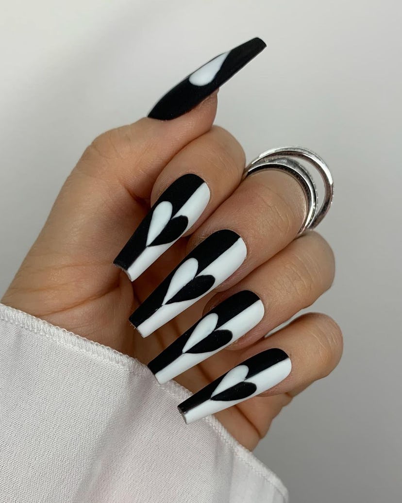 Mod black and white heart nail designs are on-trend.