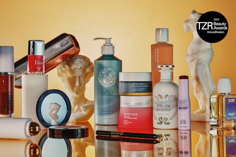 Assortment of beauty products displayed with a bust sculpture, representing the 2024 TZR Beauty Grou...