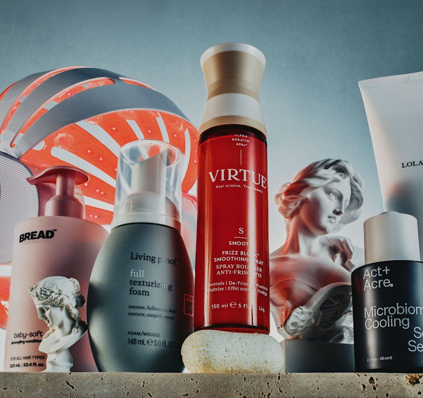 Assortment of hair care products from various brands displayed against a textured backdrop.